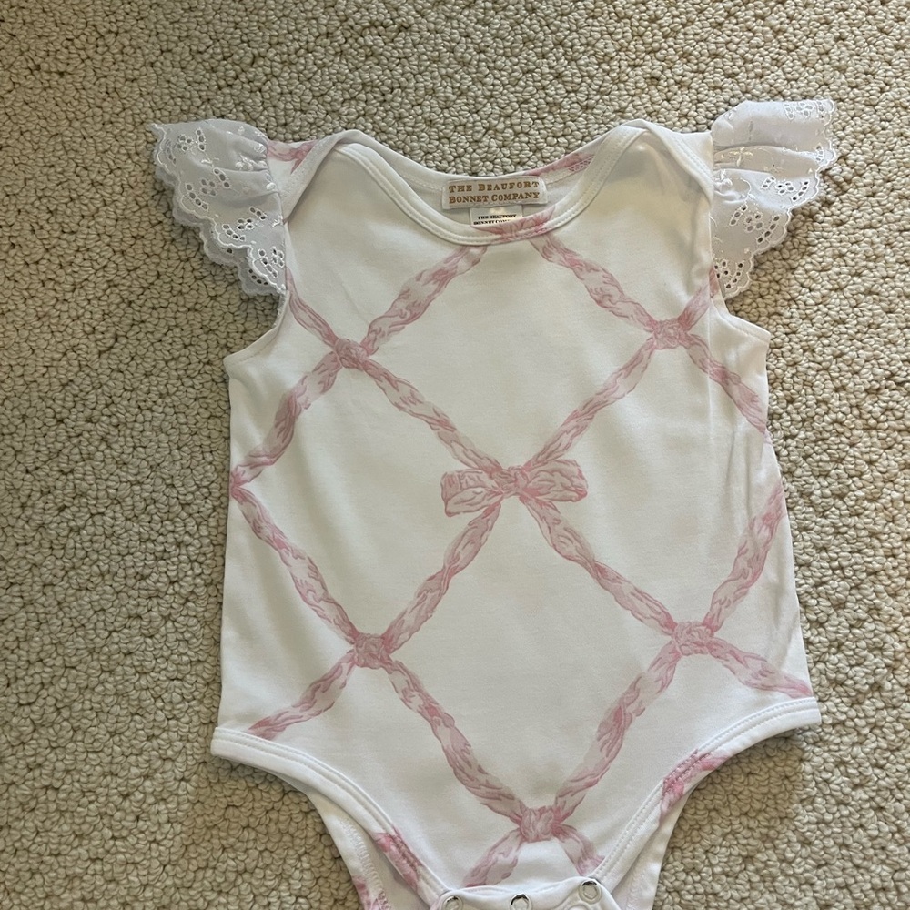 The Beaufort Bonnet Company Pink and White Bow Print Bodysuit